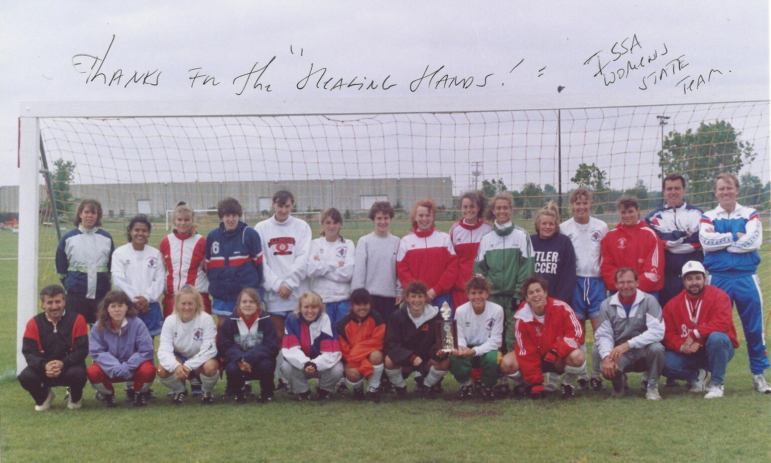 Group photo of the Illinois Women’s State Soccer Team posing on the field with their coaches and medical staff, including Dr. Steve Segal, team chiropractor and doctor.